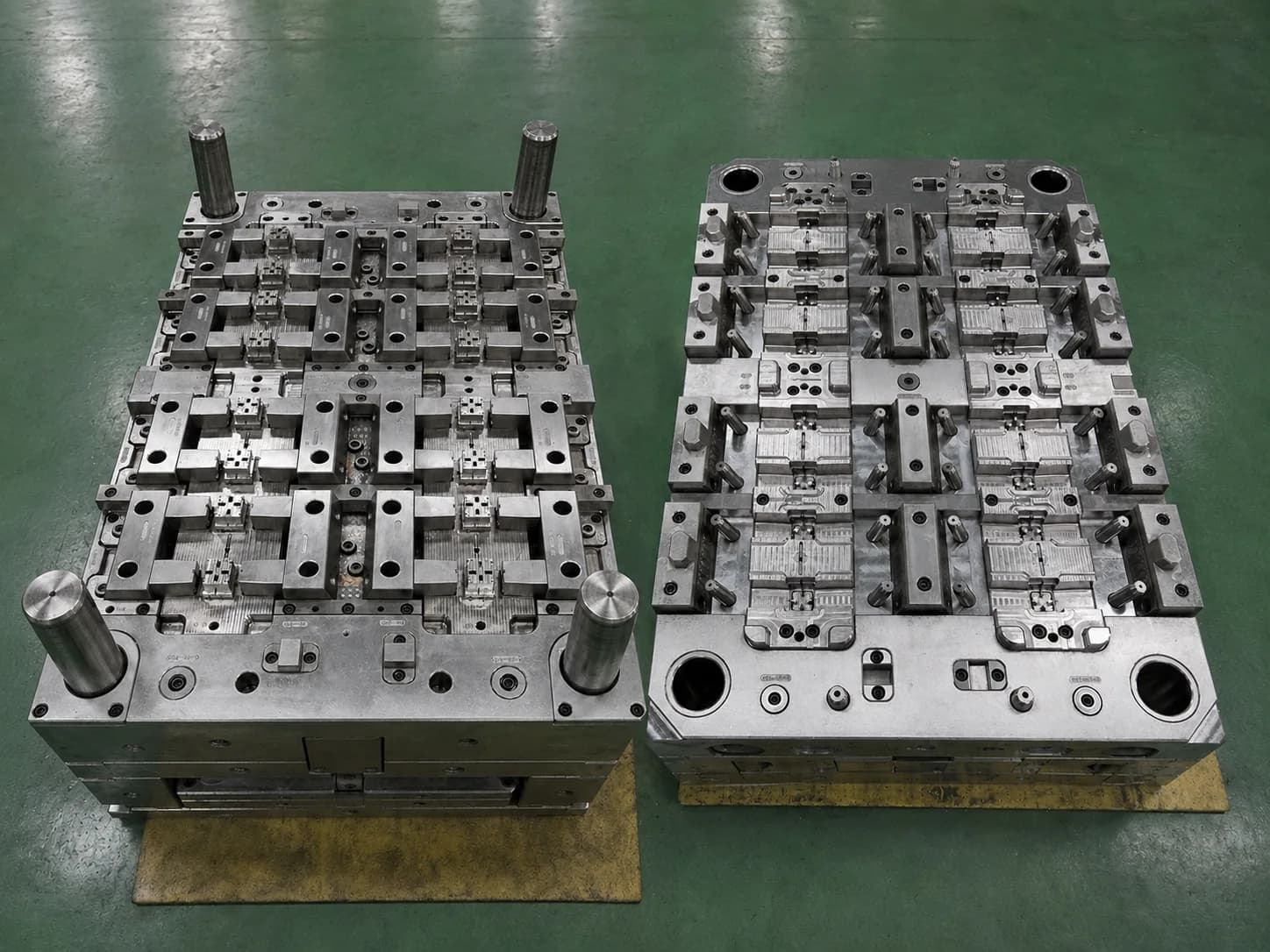 Multi-cavity injection mold with repeated production cavities